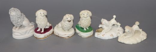 Six Staffordshire porcelain figures of poodles, c. 1830-50, one chasing a rat, h. 4.5-8.