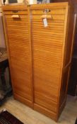 A double tambour shutter filing cabinet W.79cm