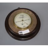 A Negretti & Zambra plate mounted oak aneroid barometer