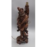 A Chinese carved hardwood figural carving height 48cm