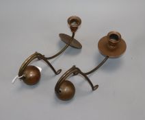 A pair of German brass Arts & Crafts candlesticks by G.M. Thurnauer & Brothers (1887-1914)