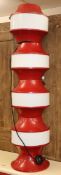 A 1970's red tin and glass floor lamp H.117cm