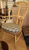 An Ercol elm and beech elbow chair