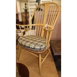 An Ercol elm and beech elbow chair