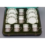 A George Jones & Sons porcelain set of coffee cans and saucers, silver mounted and cased