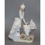 A Lladro of lady pushing a pram height 33.5cm