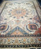 A Heriz brick red ground carpet (faded) 375 x 275cm