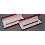 A Must de Cartier gold plated fountain pen and similar ballpoint pen, both with box and