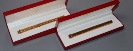 A Must de Cartier gold plated fountain pen and similar ballpoint pen, both with box and