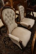 A Victorian mahogany spoonback armchair and matching nursing armchair