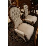 A Victorian mahogany spoonback armchair and matching nursing armchair