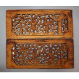 A set of four Chinese carved wood panels