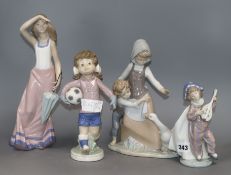 Three Lladro figure groups and a Nao figure