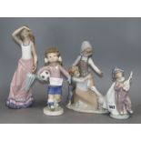 Three Lladro figure groups and a Nao figure