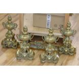 A pair of French brass andirons and fire curb