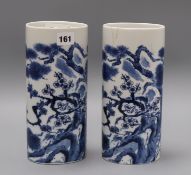 A pair of Chinese blue and white oval section sleeve vases height 25cm (one a.f.)