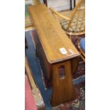 An Ercol elm drop leaf dining table W.107cm