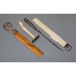 A silver moulded ivory letter opener and three other silver mounted items