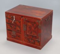 A Japanese lacquered table cabinet