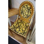 A pair of giltwood side chairs, the seats and backs with Versace yellow flower head print