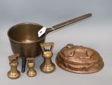 An 18th century bell metal skillet, by Warner, three Georgian bell weights and a copper jelly mould