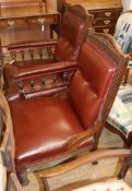 A pair of Victorian oak library chairs