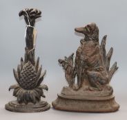 Two Victorian cast iron door stops Largest 35cm