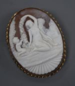 A 9ct gold mounted oval cameo brooch, carved with a lady and young child, 63mm.