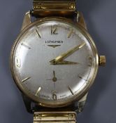 A gentleman's 9ct gold Longines manual wind wrist watch, on associated flexible strap.