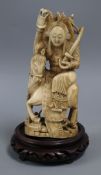 A 19th century Chinese walrus ivory figure of Hua Mulan H.16cm