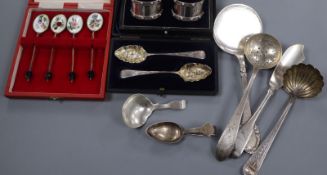 Three cased stes including silver and enamel spoons and napkin rings and six items of silver/white