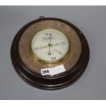 A Negretti & Zambra plate mounted oak aneroid barometer