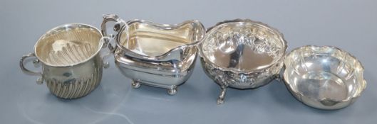 A silver milk jug, a Victorian embossed silver sugar bowl, a porringer and an 800 standard bowl.