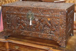 A Chinese carved camphorwood chest W.104cm