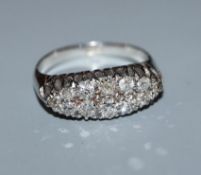 An 18ct navette-shaped twelve-stone two row diamond cluster ring, size P.
