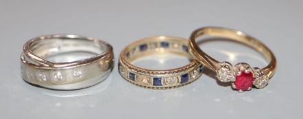 Three assorted 9ct gold and gem set rings.