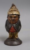 A small antique cast iron painted inkwell, in the form of a dwarf