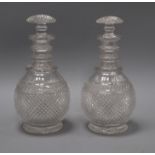 A pair of Victorian cut glass decanters height 26cm