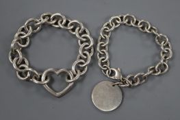 Two Tiffany & Co sterling bracelets, one with heart motif and one with tag.