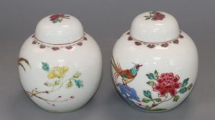 A pair of Chinese famille rose ginger jars and covers