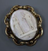 A late Victorian pinchbeck mounted oval cameo brooch, carved with Roman figures, 68mm.