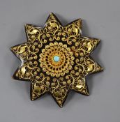 A late Victorian yellow metal mounted tortoiseshell sat brooch, with cannetile work decoration and