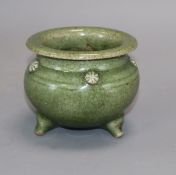 A Chinese celadon glazed tripod censer