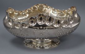 An unusual Victorian silver oval rose bowl, of large proportions, having shaped scalloped edge and