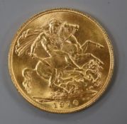 An Edward VII 1910 gold full sovereign.