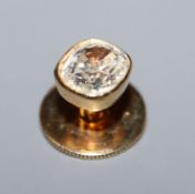 A yellow metal and diamond set dress stud, the old cushion cut stone measuring approximately 6.8mm