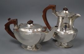 A 1930's silver hot water jug and teapot, J.W. Tiptaft & Son Ltd, Birmingham, 1933, 37.5 oz.