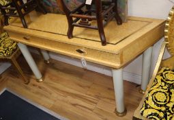 A birds eye maple veneered side table, fitted with two drawers W.144cm