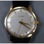 A gentleman's 14k Huguenin manual wind wrist watch, on associated leather strap.