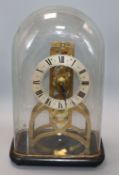 A brass fusee skeleton timepiece under glass dome H.30cm